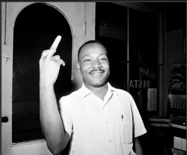 The Reverend Doctor Martin Luther King, Junior appropriately expressing his feelings for supremecists with an upraised middle finger