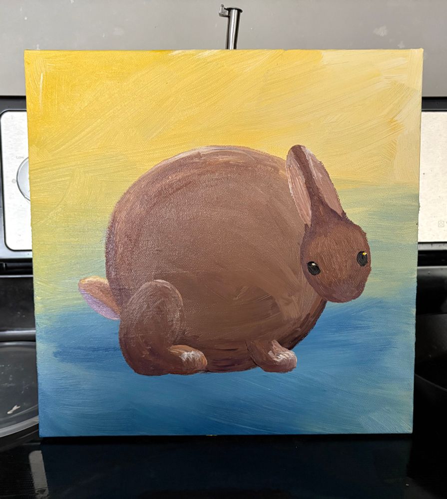 A painting of a rabbit shaped like a perfect circle on a yellow and blue ombré background 