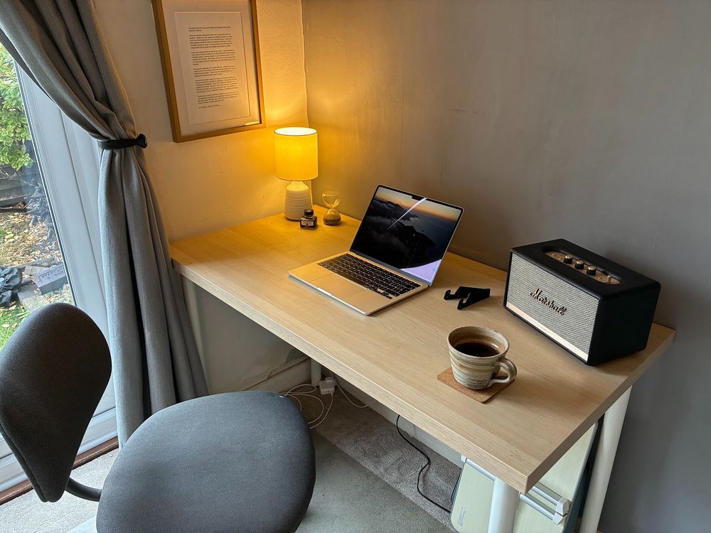 My desk in the corner of the dining room (formerly my eldest's bedroom) at home.  I have a MacBook open on my desk, a lamp and my amazing Marshall Bluetooth speaker.  Oh and coffee, obvs.