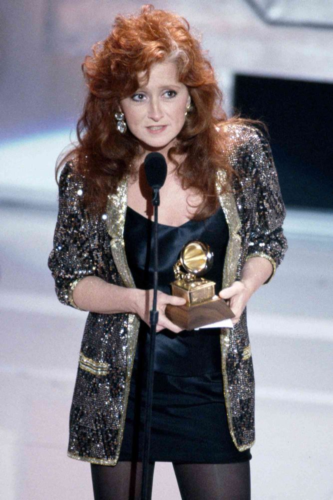 Bonnie raitt accepting the Grammy with her iconic hair 