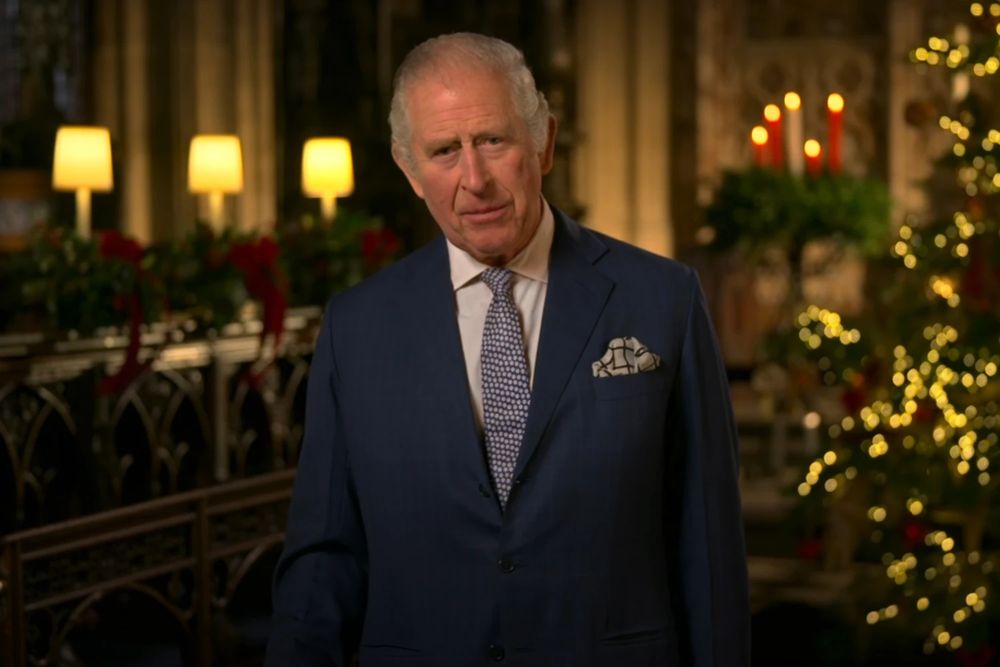 King Charles, in posh Xmassy room, addressing camera.
