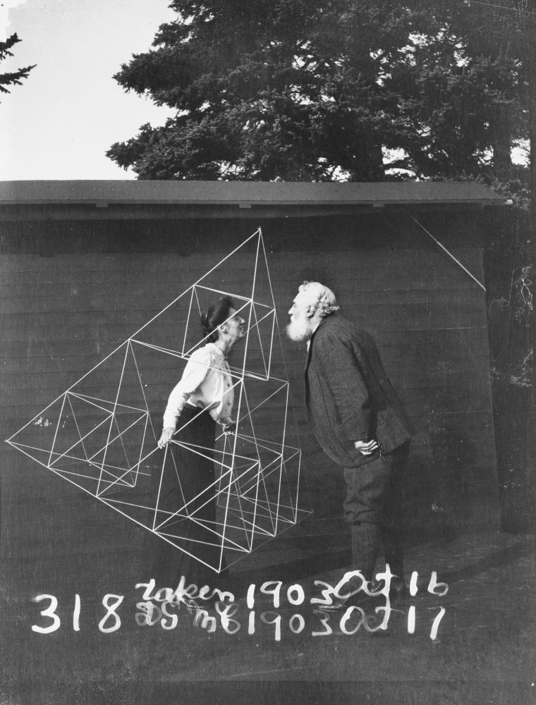 Alexander Graham Bell facing his wife, Mabel Hubbard Gardiner Bell, who is standing in a tetrahedral kite, Baddeck, Nova Scotia. October 1903. Gilbert H. Grosvenor Collection of Photographs of the Alexander Graham Bell Family, Library of Congress Prints and Photographs Division.