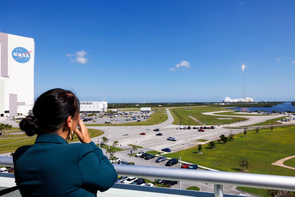 Poet Laureate Ada Limón watches the Europa Clipper lift off from Kennedy Space Center in Cape Canaveral, Florida, October 14, 2024. The clipper, bound for Jupiter's icy moon, Europa, bears a vault plate engraved with Limón's poem, "In Praise of Mystery." Photo by Shawn Miller/Library of Congress.