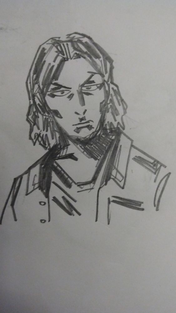 harshly lit individual with a long, Cher-like face and Matthew Mercer looking haircut wearing a tee and overshirt 