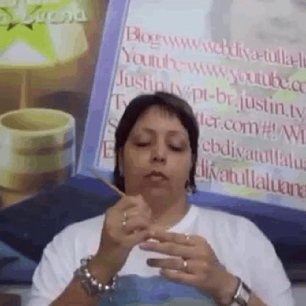 a woman is holding a toothpick in her mouth in front of a sign that says youtube .