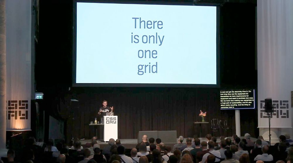 me on stage in front of slide that says 'there is only one grid'