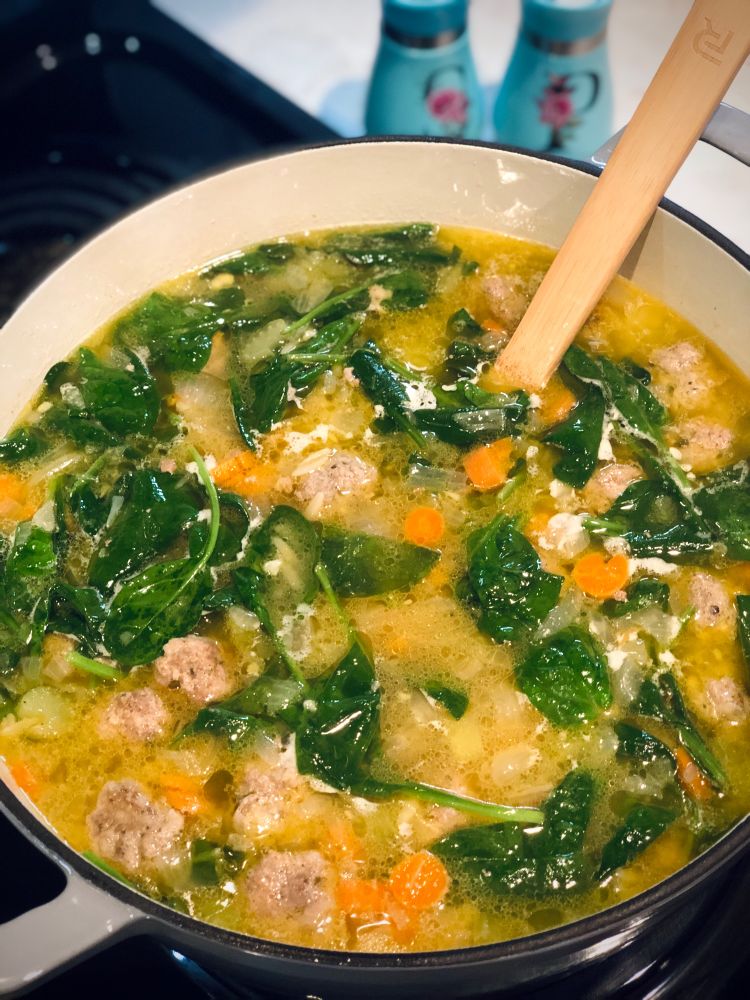 Italian Wedding Soup Cooking on the Stove. https://www.cookingclassy.com/italian-wedding-soup/