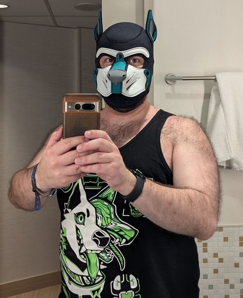 Hyena wearing his pup hood and a tank top