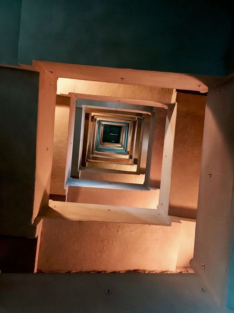 stair case seen from below - squares that get smaller and smaller as you look up.