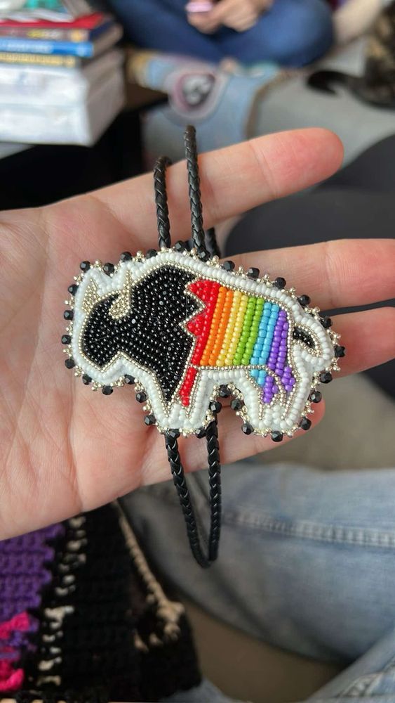Beadwork bolo tie designed to look like a rainbow buffalo.