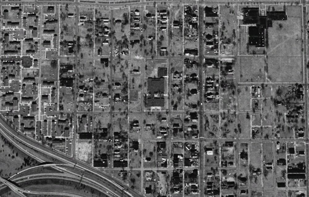 Black and white screenshot of Core City, Detroit from 1999. Each block is about half empty lots