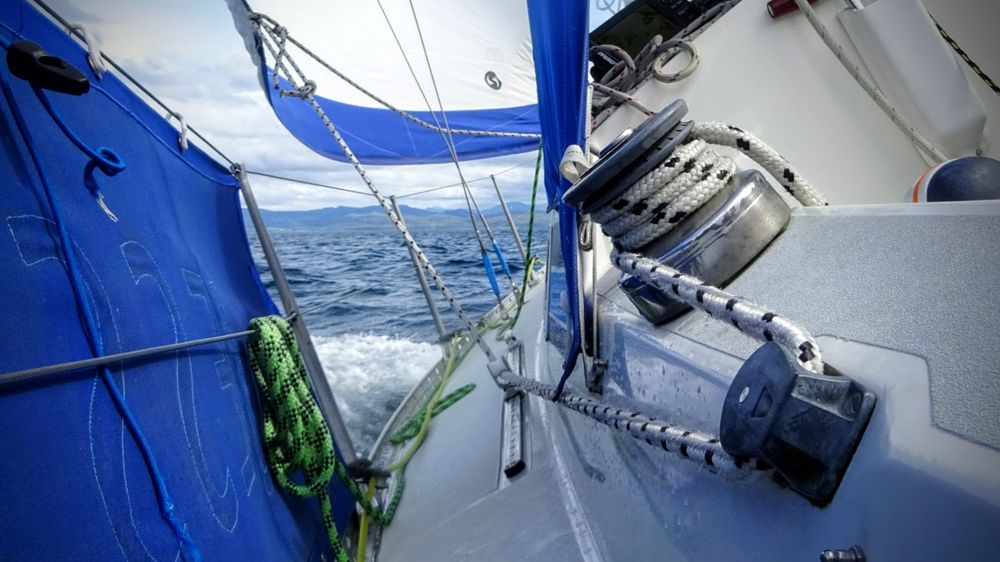 Picture looking along the deck of a sailing boat heeling to port.