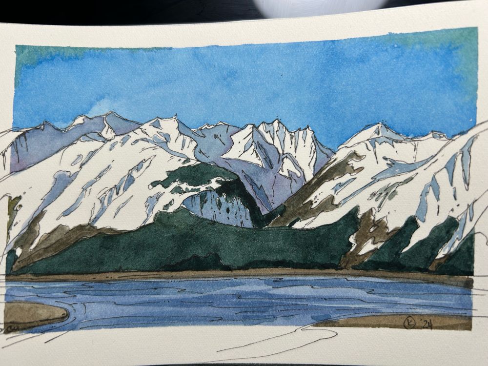 A 4 by 6 inch water color painting of mountains across a river, the sun is shining from the left, casting shadows

