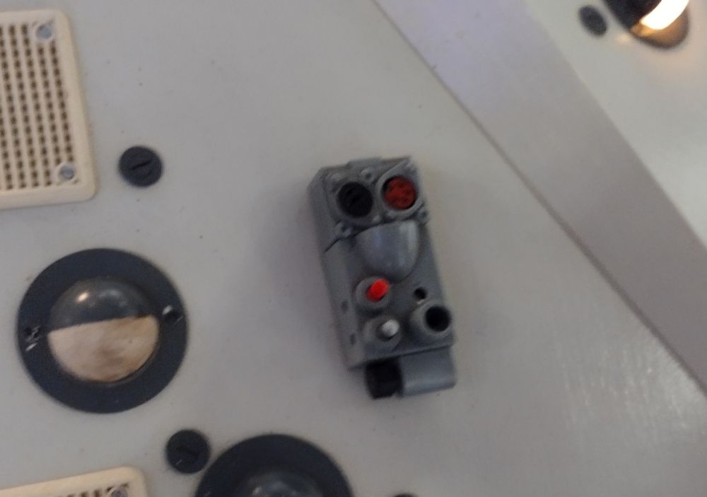 Close up on the fast return switch housing on a fan built TARDIS console which lacks a hastily inked in label like what the one on TV had.