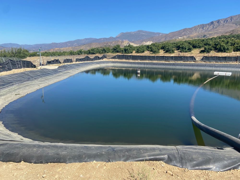 This reservoir at Brokaw Ranch Co. in Santa Paula holds 1 million gallons of water and is one of two reservoirs on the farm. Photo by Rob McCarthy