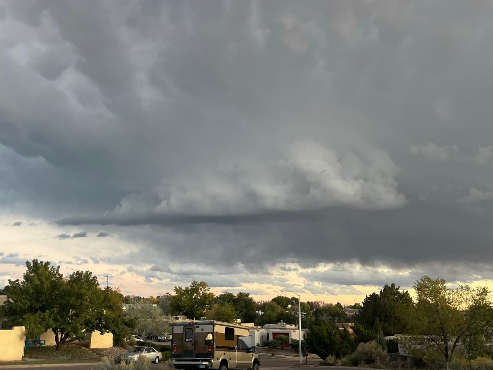 A picture of a well defined wallcloud, with a tail cloud and rotating lowering.