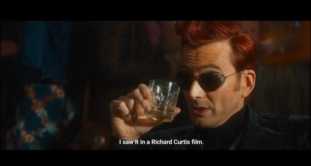 Crowley in Good Omens with the caption "I saw it in a Richard Curtis film"