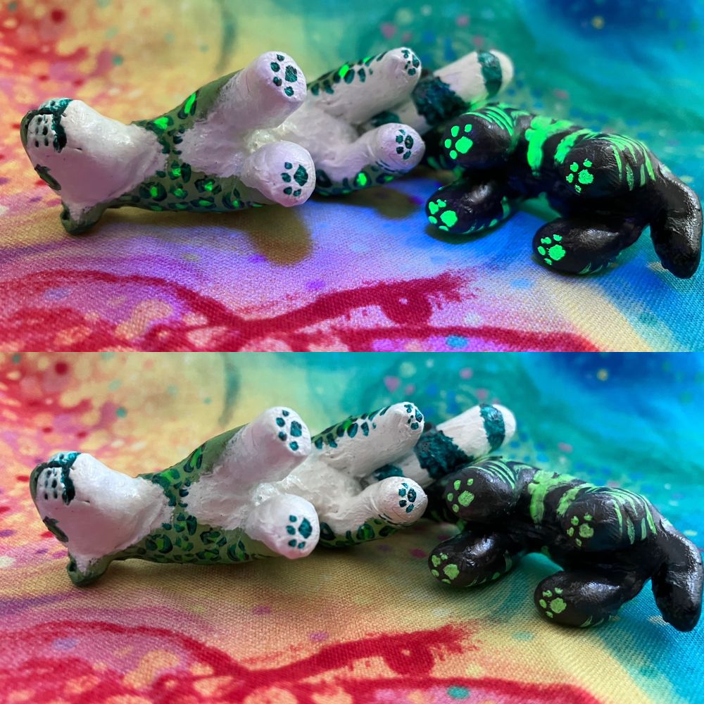 A photo of two sculptures, both mainly green, one is a striped hyena (yeen)and the other is a snow leopard (snep). Two views of them as shown, once under black light and the other under natural light