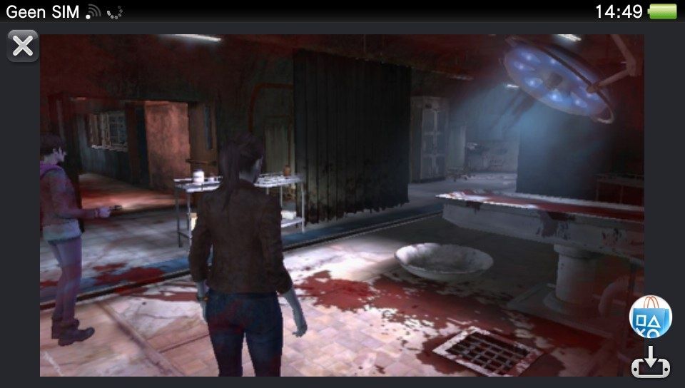 Screenshot from the game "Resident Evil: Revelations 2" on the PS Vita. Claire walks through a operation room. The floor is totally covered in blood stains. The operation lights are still on.