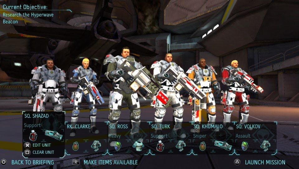 Screenshot from the PS Vita game Xcom Enemy Unknown. Six well equipped soldiers are standing in the aircraft hangar ready to embark on their next mission. 