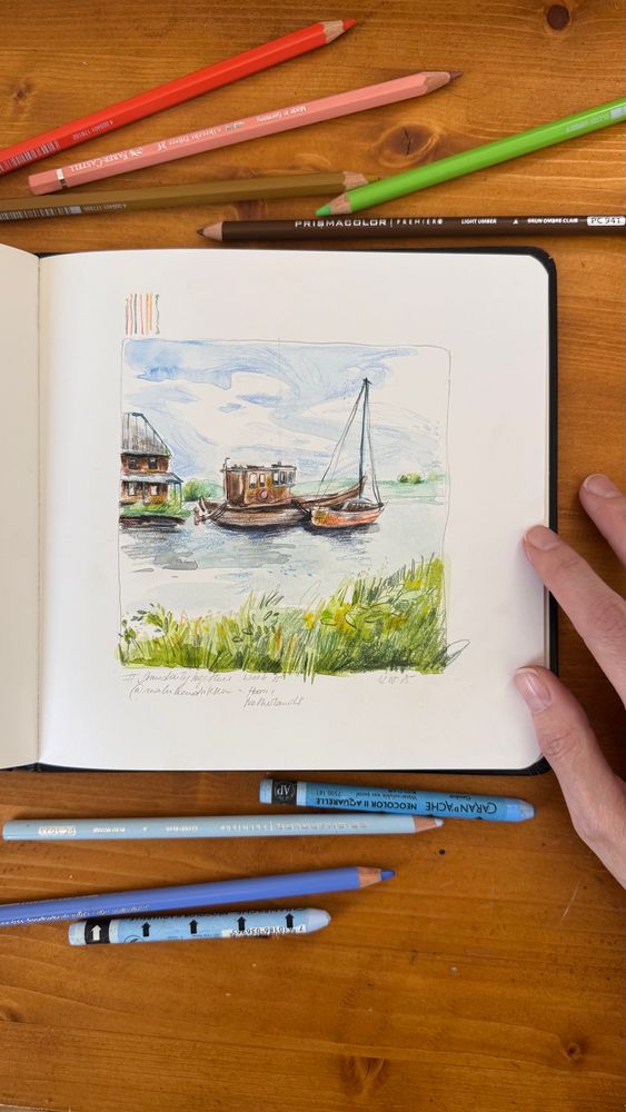 A mixed media sketch depicting two boats anchored in a serene body of water, with a small wooden building on the left. Lush green grass edges the foreground, and a bright sky with soft clouds fills the background.