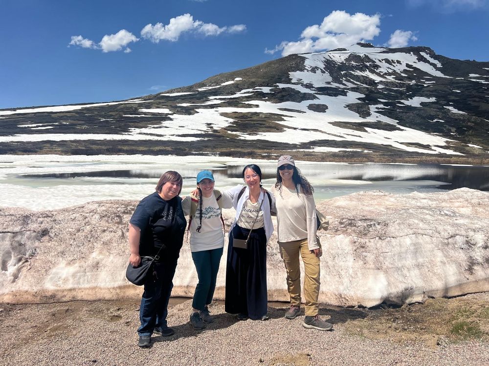 A picture of 4 women astrophysicists at Independence Pass, CO. It was warm that day and the snow was fast melting.