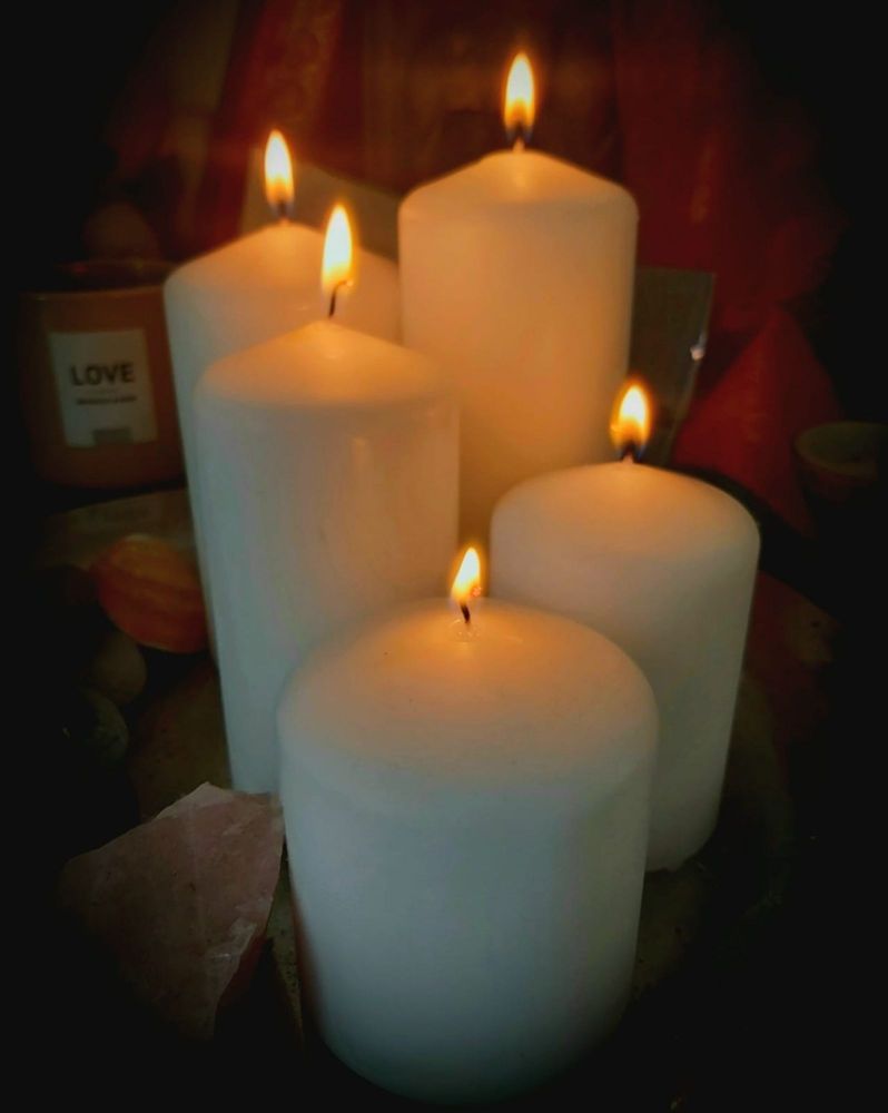 Five lit candles to show mourning of the loss of a loved one.