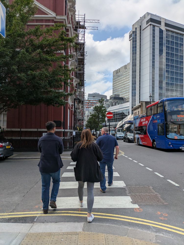 Junction of Transept and Chapel Streets looking West with three pedestrians crossing a simple side road zebra without Belisha beacons.