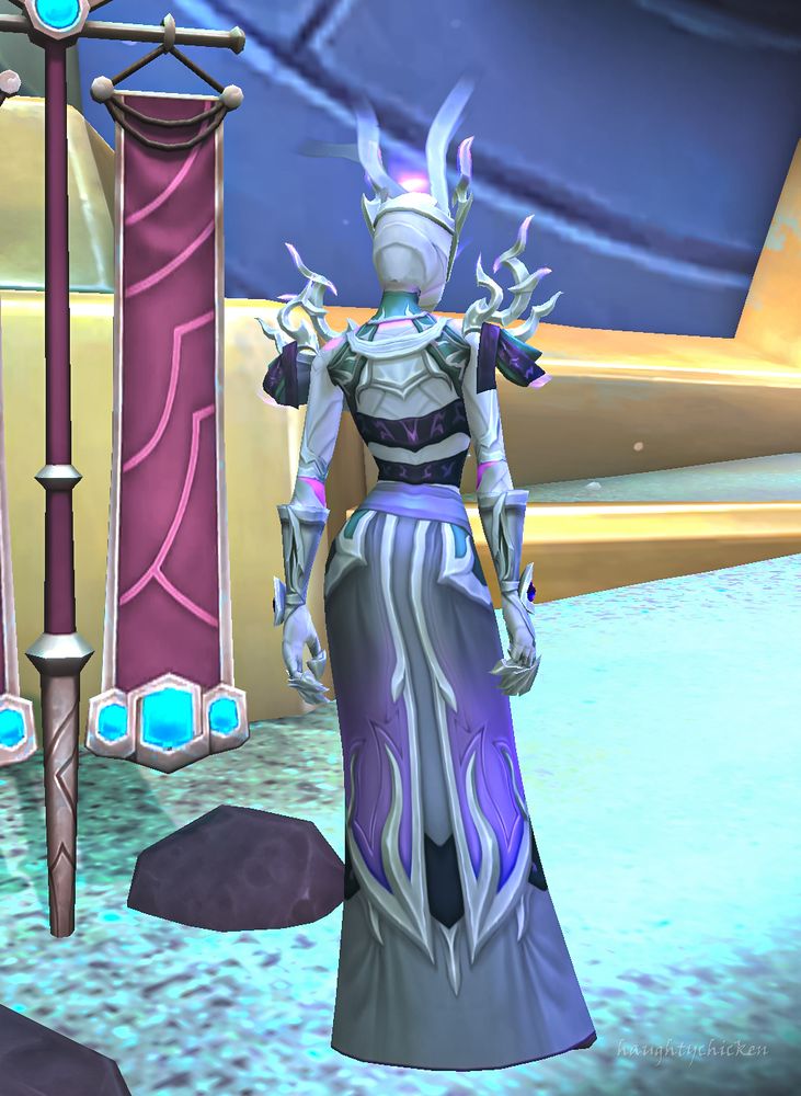 The back of the robe with the skirt featuring silver, grey and muted puple, and the top having a double ribboned, runed back piece effect.