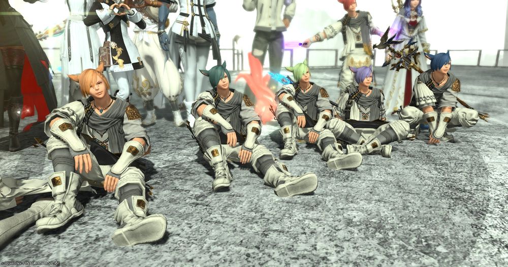 A closeup of the Grainbow among a screenshot of healers posing victoriously together in the end zone of Copied Factory. 