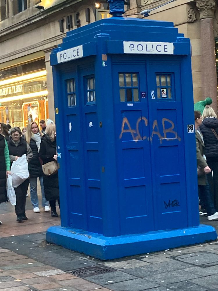 a tardis on glasgow buchanan street with “ACAB” spray painted on it