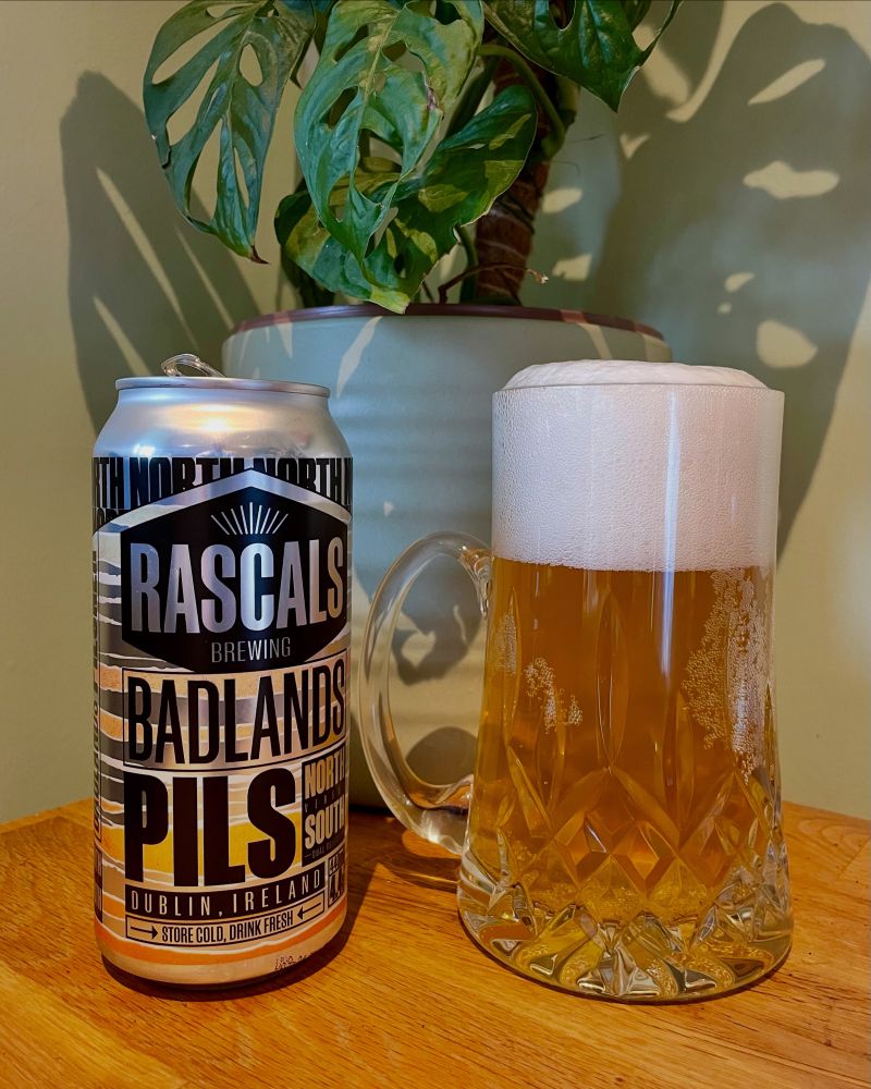 A can of Badlands Pils by Rascals Brewing poured into a posh glass