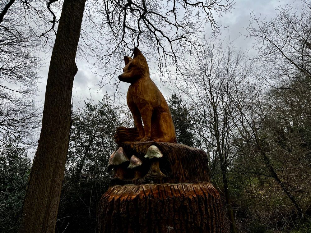 A close up of the fox carving.