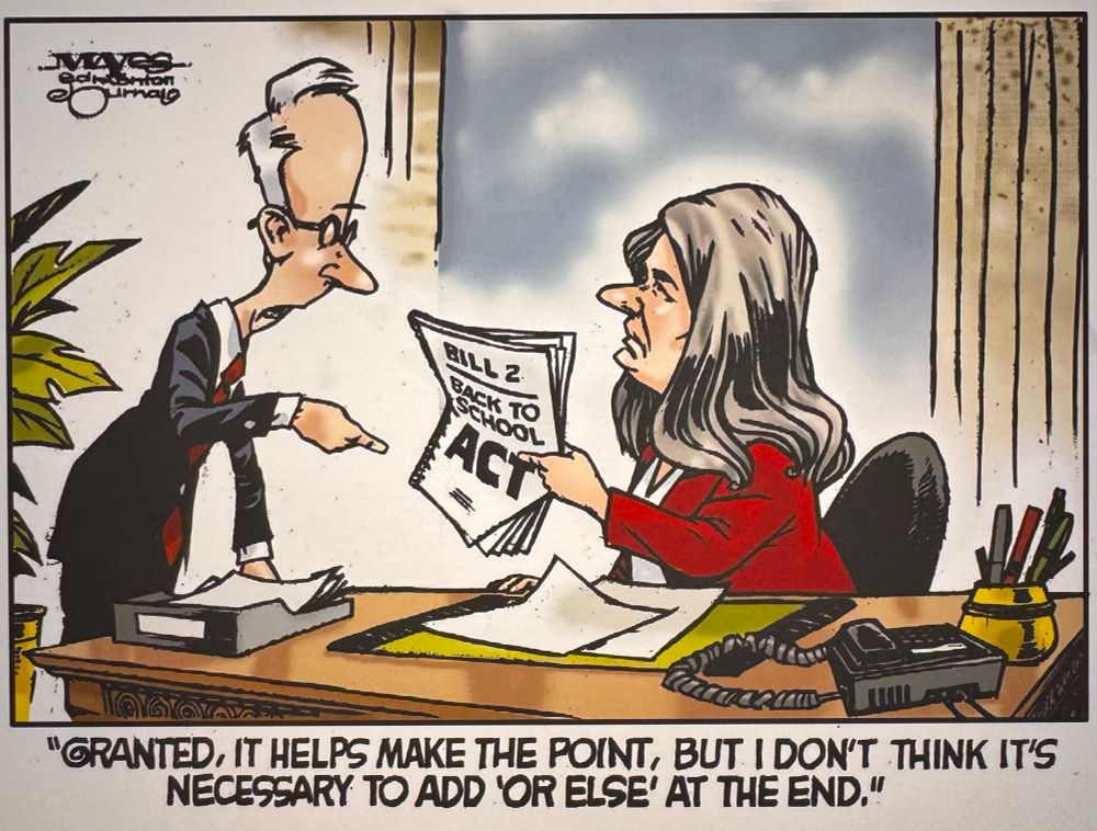 Man pointing to Alberta paperwork held by Dani