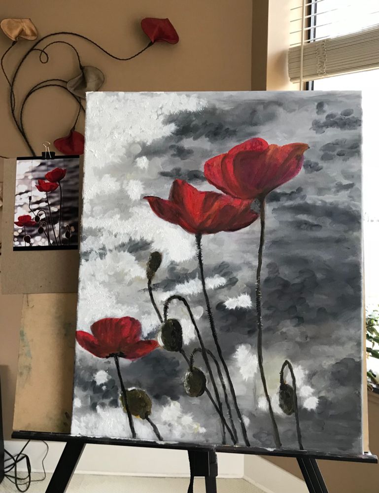 Poppies & poppy buds on an easel with inspirational photo on the left