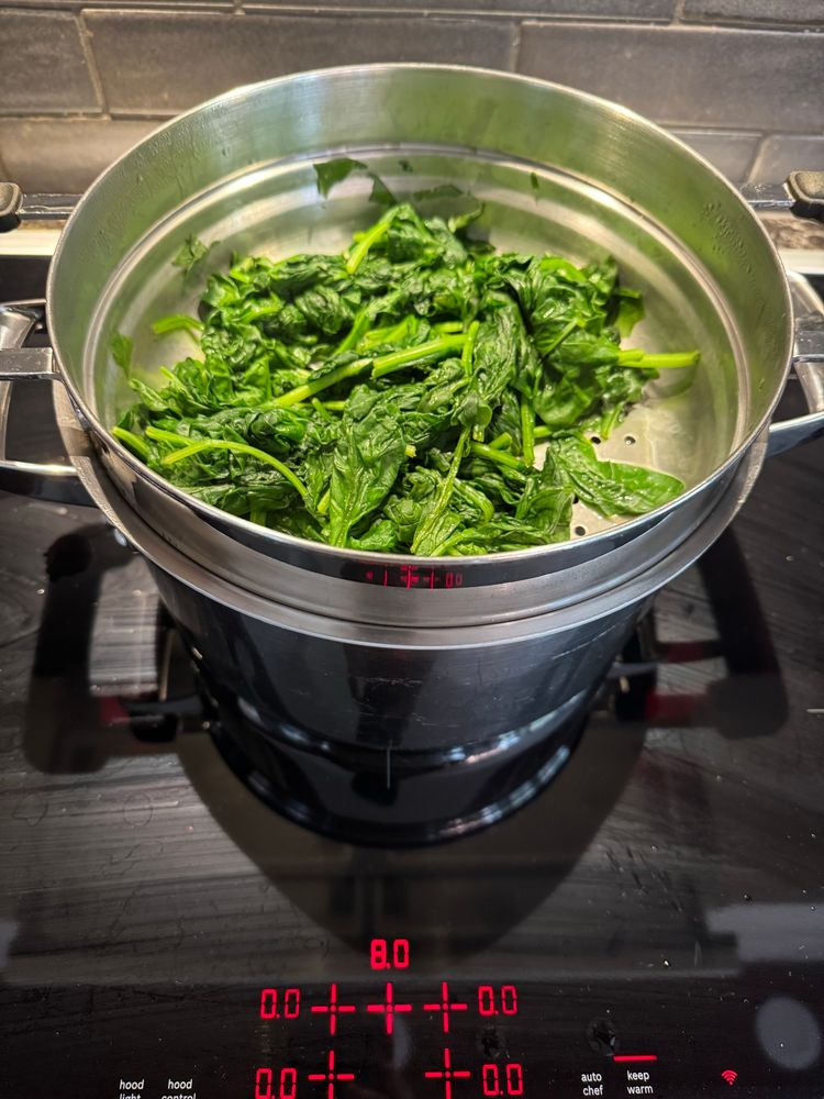 Steamed leaves reduced by 75% of original volume 