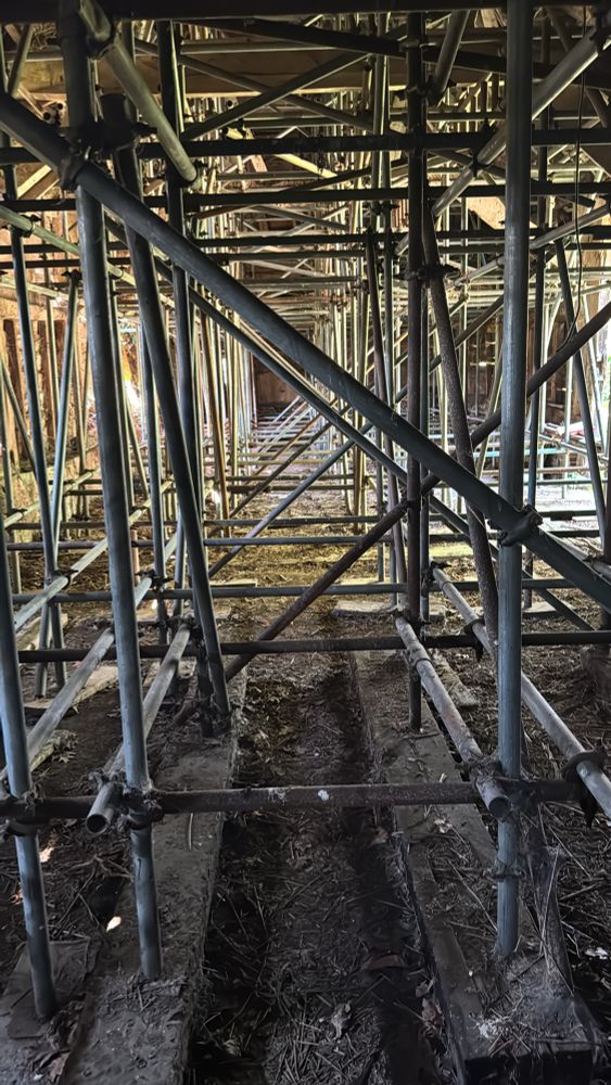 17th century barn held up by extensive internal scaffold frame.