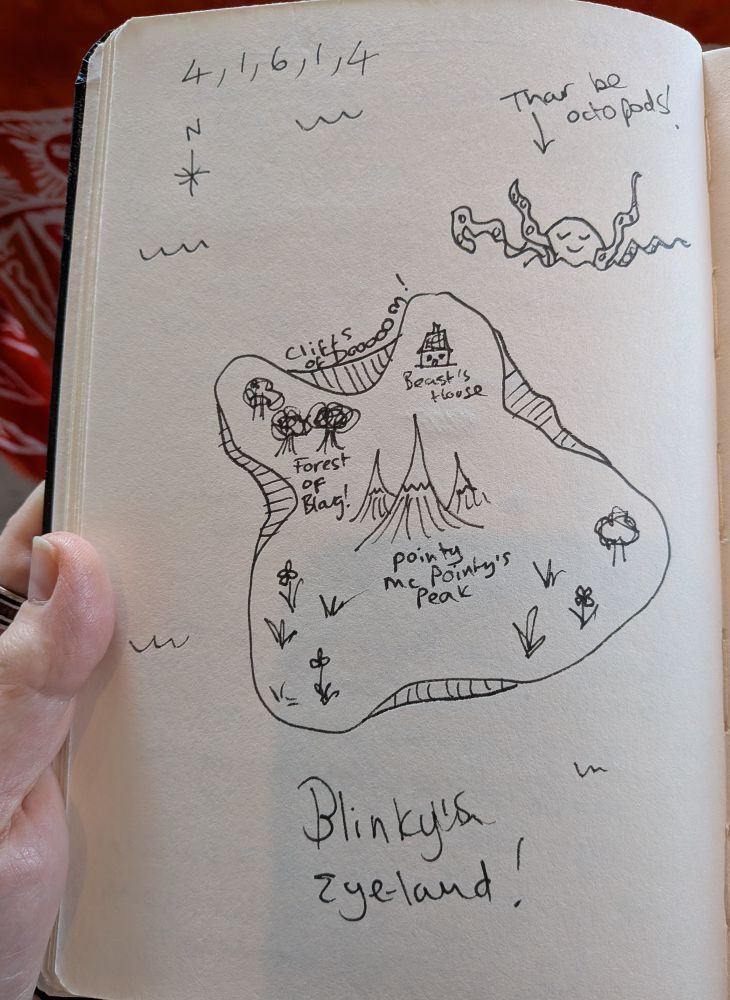 A sketchbook page with a map of an island doodled on it. It's labelled Blinky's Eye-land, spelled like Eyeball eye and land. There's a compass and some scrawled numbers in one corner, and a giant octopus waving out of the sea labelled 'thar be octopods.' The island itself is marked as having cliffs around its edges called the cliffs of doo-oo-oo-oo-oom, trees and plants growing on it, and tall pointy mountains in the middle, the tallest of which is labelled pointy McPointy's peak. There's also a collection of trees labelled Forest of Blarg, and a small house for a mythical beast. We aren't sure if it's Blinky's house, it doesn't say.