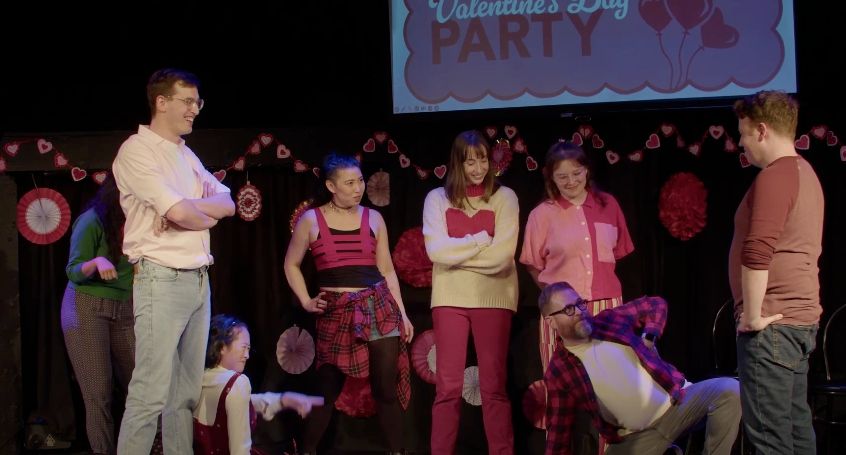 improvisers in red and pink create a stunning tableau