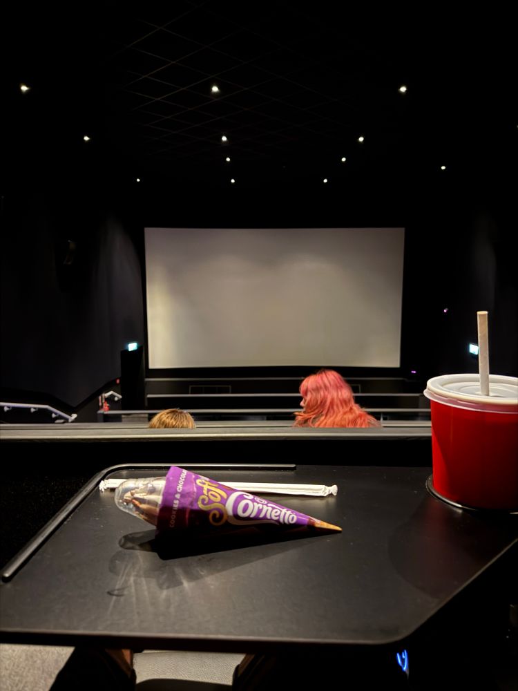 A photo of the cinema screen I’m sitting in, I have a big cup of Dr Pepper and a Cornetto