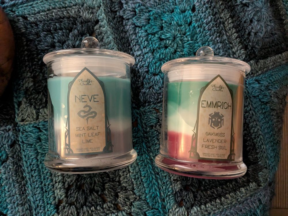 Two candles from Planeshift candles. Neve and Emmrich