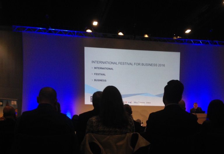 shot of powerpoint at a conference, it says 'INTERNATIONAL FESTIVAL FOR BUSINESS 2016', followed by three bullet points:
'INTERNATIONAL'
'FESTIVAL'
'BUSINESS'