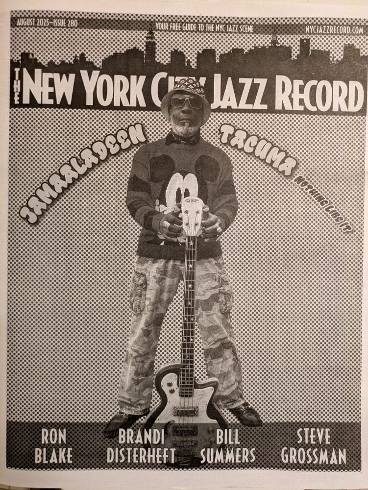 New York City Jazz Record August 2025 issue with Jamaaladeen Tacuma on the cover wearing a Mickey Mouse sweatshirt and holding his bass. B&W newspaper print.