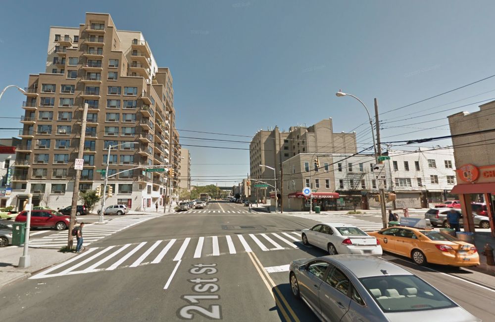 Google Street View photo of the intersection between Astoria Blvd and 21st St in Queens, NY. It has a couple of 12-story apartment buildings.