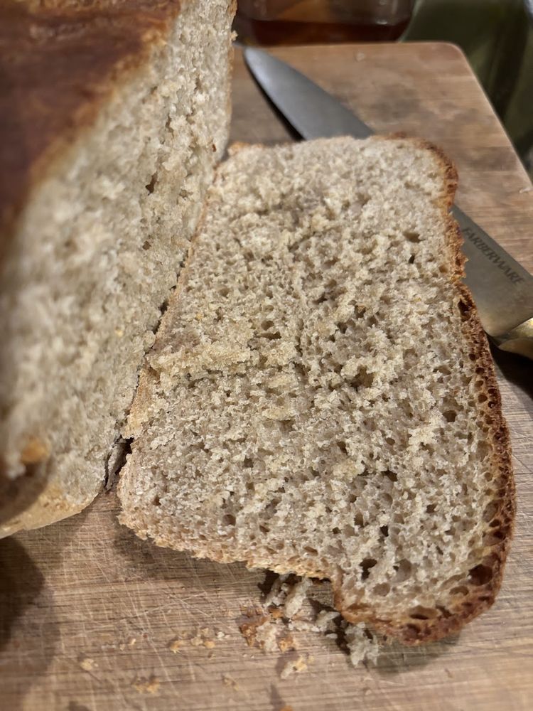 freshly baked and sliced sourdough bread on a cutting board
