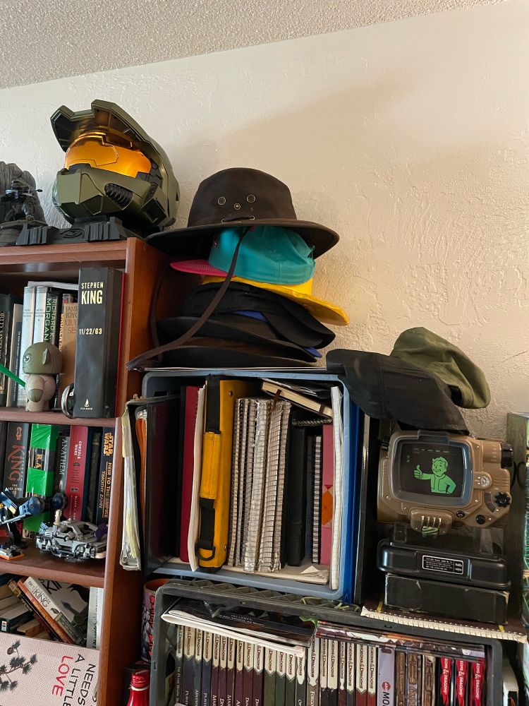 There is now a brown, adventure hat in top on the yellow and teal hats!