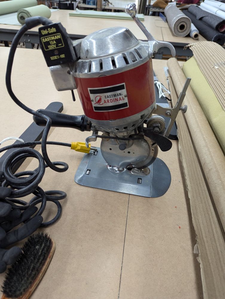 A Eastman cardinal cutter on a cutting table