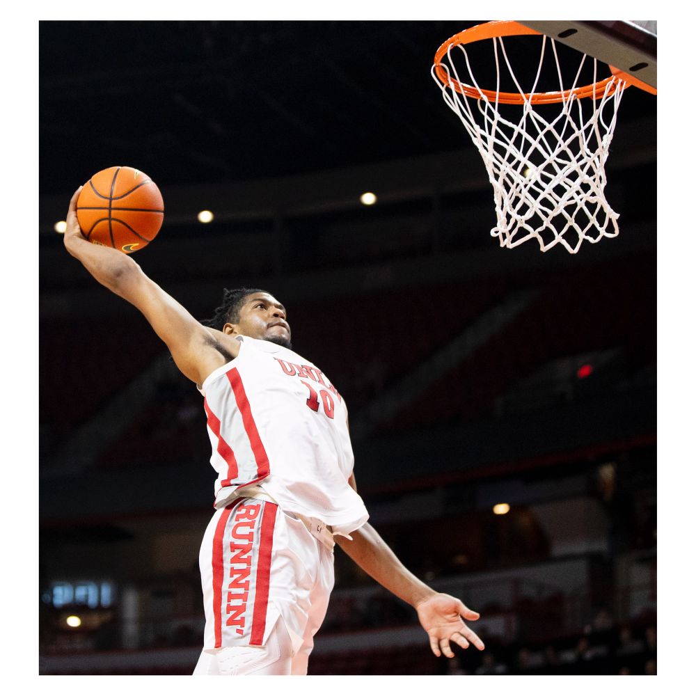 UNLV guard Jaden Henley (10) looks to dunk the ball.