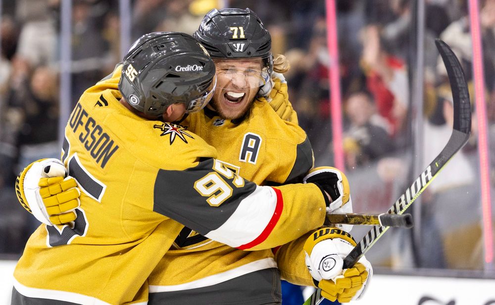 Golden Knights center William Karlsson (71) is hugged by right wing Victor Olofsson (95) after scoring a goal during the third period.