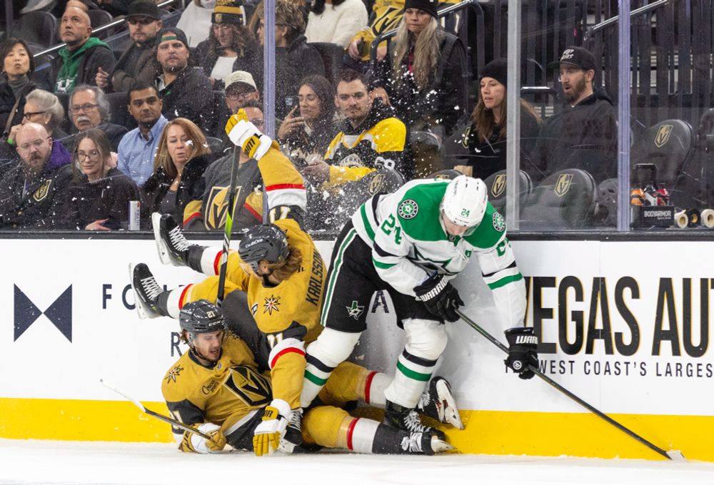 Dallas Stars center Roope Hintz (24) causes Golden Knights center William Karlsson (71) and Golden Knights center Brett Howden (21) to trip.
